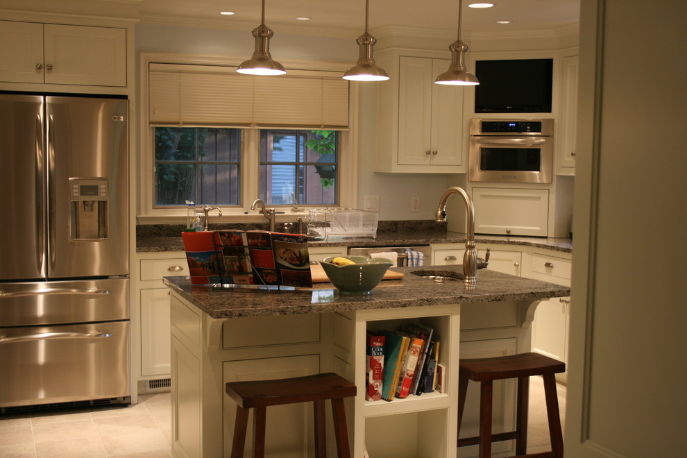 Inspiration for a mid-sized l-shaped beige floor eat-in kitchen remodel with beaded inset cabinets, white cabinets, stainless steel appliances and an island