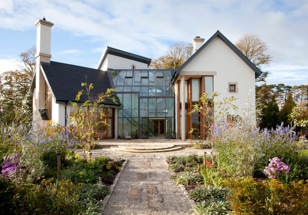 Inspiration for a contemporary two-storey white exterior in Hampshire with a gable roof.