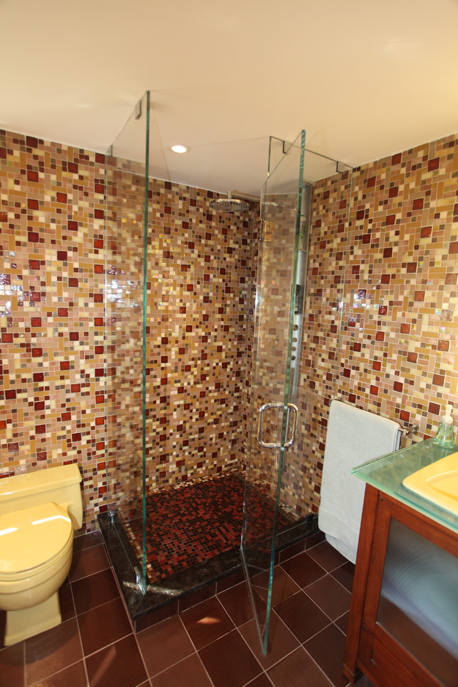 This is an example of a large contemporary master bathroom in New York with brown tile, glass tile, brown walls and ceramic floors.
