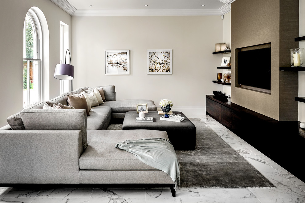 Design ideas for a large contemporary enclosed family room in Hampshire with a game room, beige walls, marble floors, no fireplace, a wall-mounted tv and white floor.