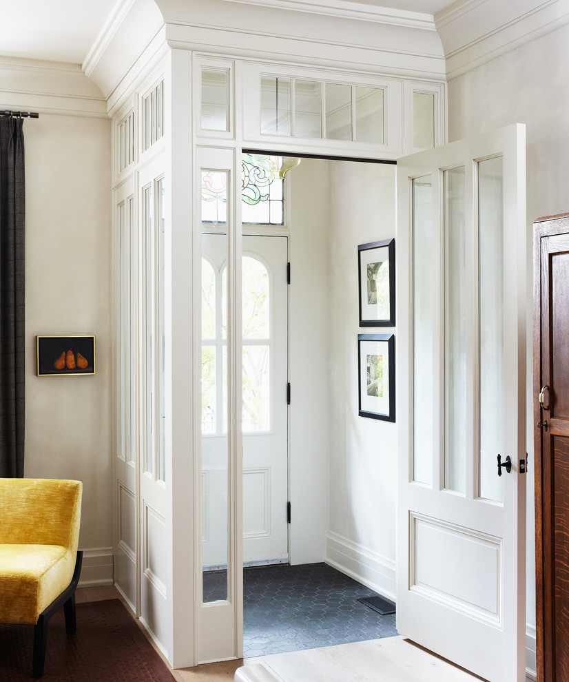 Inspiration for a traditional entryway in Toronto with white walls.