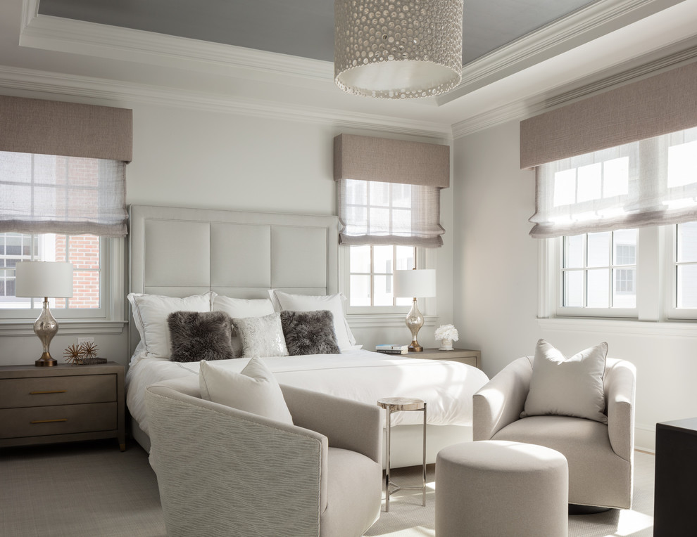 Design ideas for a transitional master bedroom in New York with white walls and beige floor.