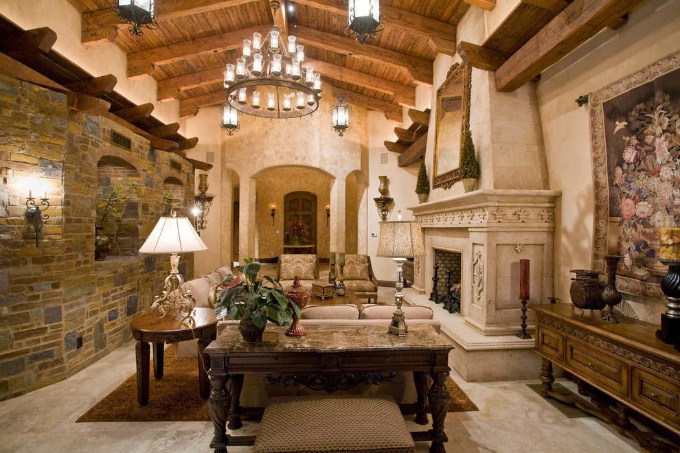 Design ideas for a large mediterranean formal open concept living room in Phoenix with beige walls, travertine floors, a standard fireplace, a plaster fireplace surround and no tv.