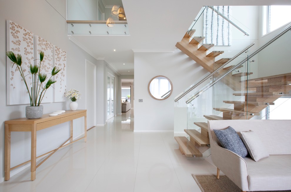 Photo of a contemporary wood u-shaped staircase in Melbourne with open risers.