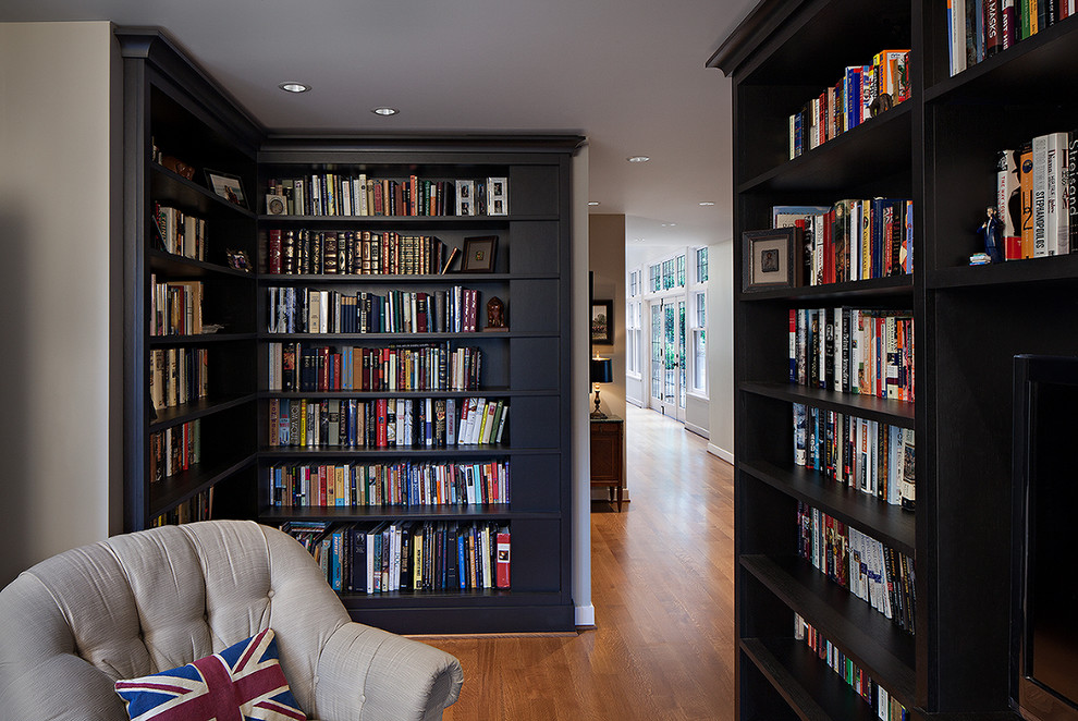 Small traditional open concept family room in Seattle with a library, grey walls, light hardwood floors, no fireplace and a built-in media wall.