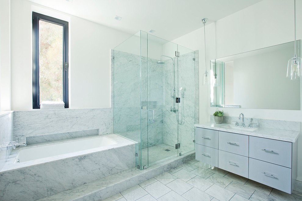 Trendy white tile corner shower photo in Los Angeles with an undermount sink, flat-panel cabinets, white cabinets and an undermount tub