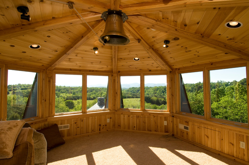 Example of a mountain style rooftop deck design with a roof extension