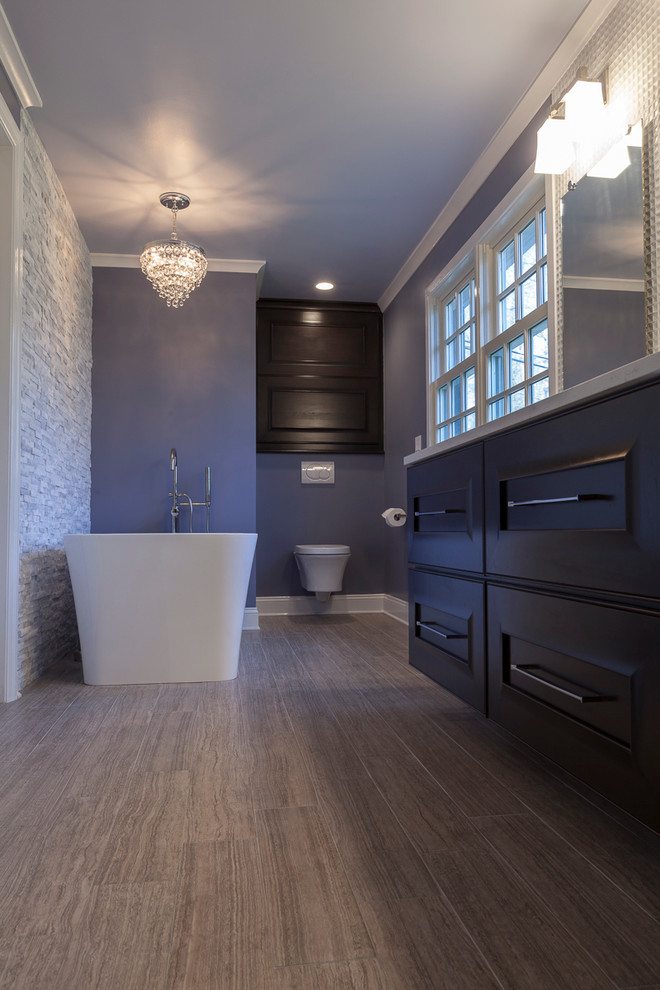 Large contemporary master bathroom in New York with flat-panel cabinets, dark wood cabinets, a freestanding tub, a curbless shower, a wall-mount toilet, white tile, porcelain tile, purple walls, porcelain floors, an undermount sink, engineered quartz benchtops, grey floor and an open shower.