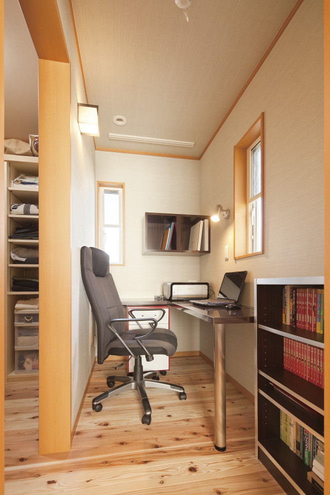 Photo of a home office in Tokyo Suburbs with medium hardwood floors.