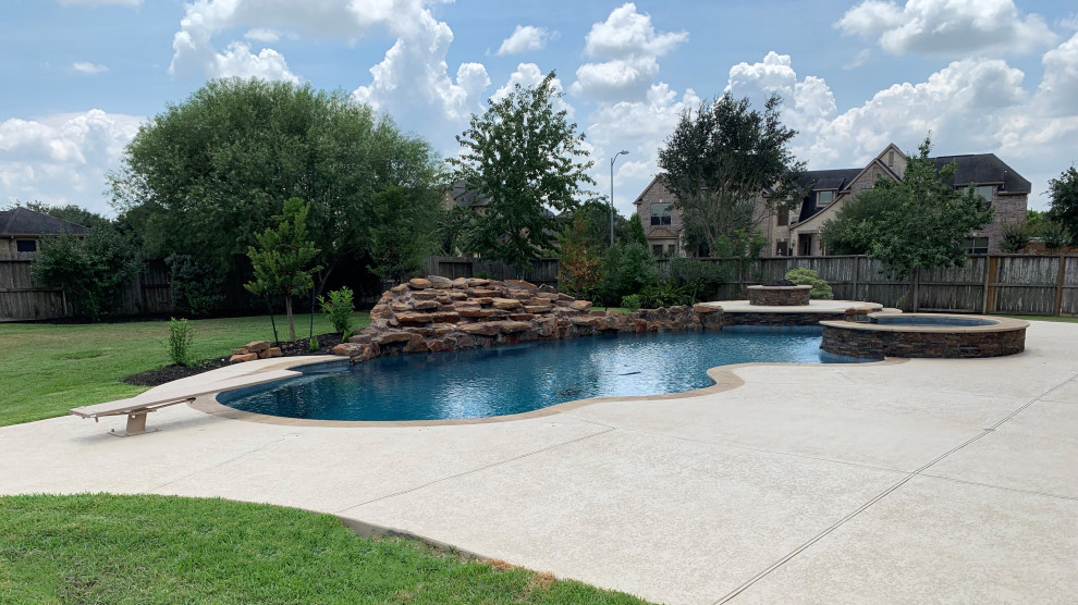 Inspiration for a huge tropical pool remodel in Houston