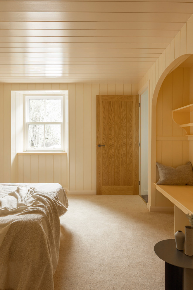 Design ideas for a traditional bedroom in Other with wood walls.