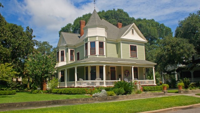 Inspiration for a large victorian multicolored two-story wood gable roof remodel in Boston