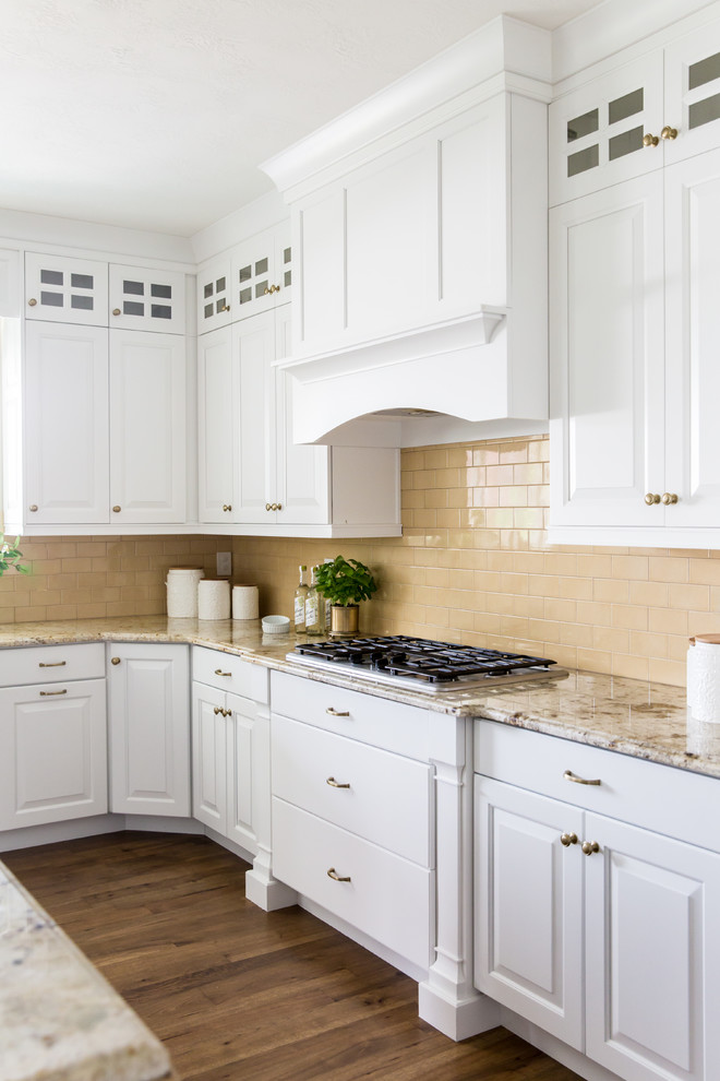 Design ideas for a large arts and crafts u-shaped eat-in kitchen in Other with a farmhouse sink, raised-panel cabinets, turquoise cabinets, quartz benchtops, stainless steel appliances, medium hardwood floors, with island, brown floor and white benchtop.