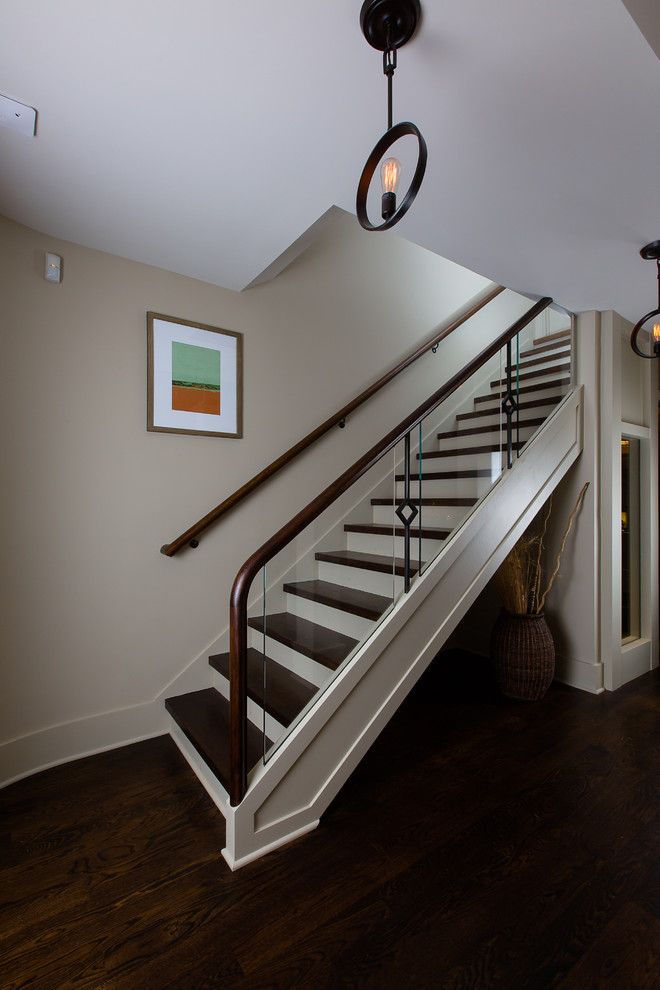 This is an example of a contemporary wood straight staircase in Atlanta with painted wood risers.