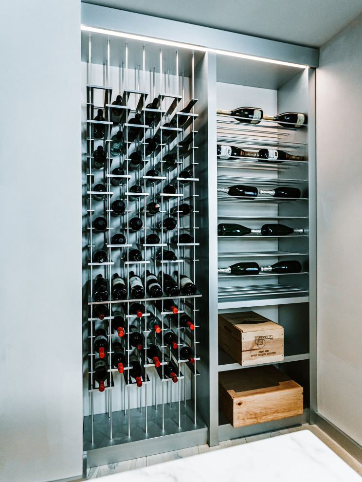 Large contemporary wine cellar in San Diego with storage racks.