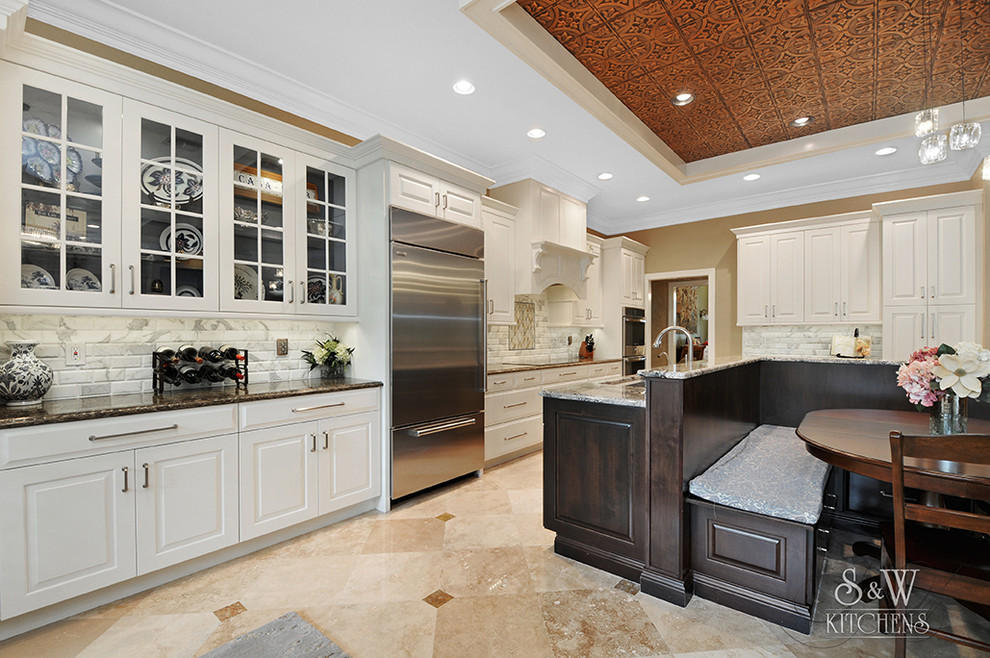 Design ideas for a large traditional l-shaped open plan kitchen in Tampa with an undermount sink, shaker cabinets, white cabinets, quartz benchtops, white splashback, stone tile splashback, stainless steel appliances, travertine floors and no island.