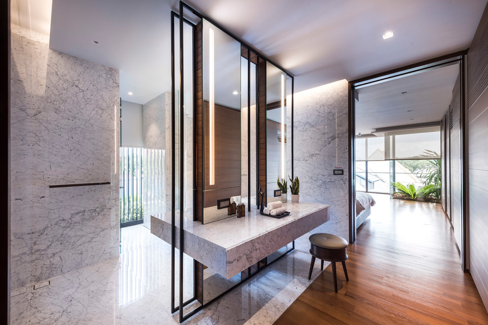 Contemporary master bathroom in Singapore with medium hardwood floors.