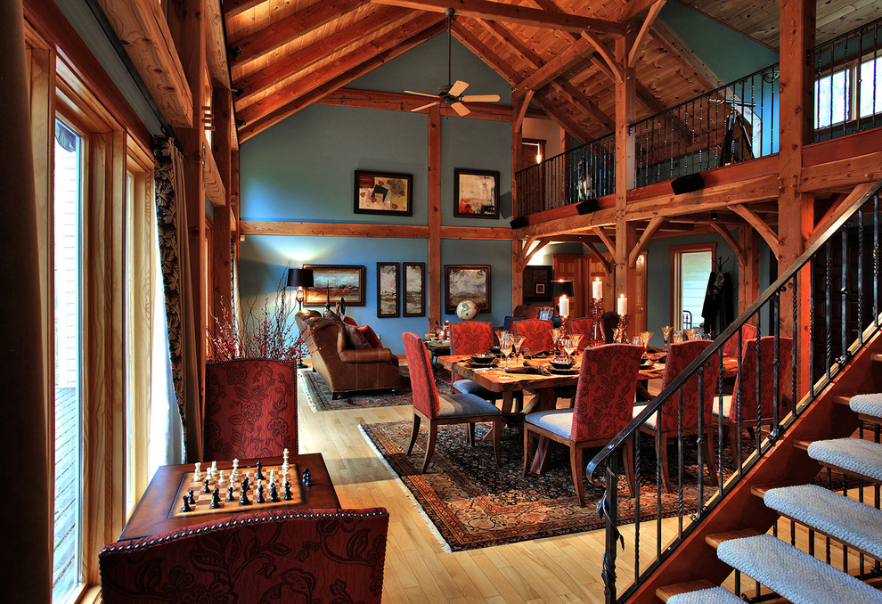 Mid-sized mountain style medium tone wood floor and brown floor great room photo in Baltimore with blue walls