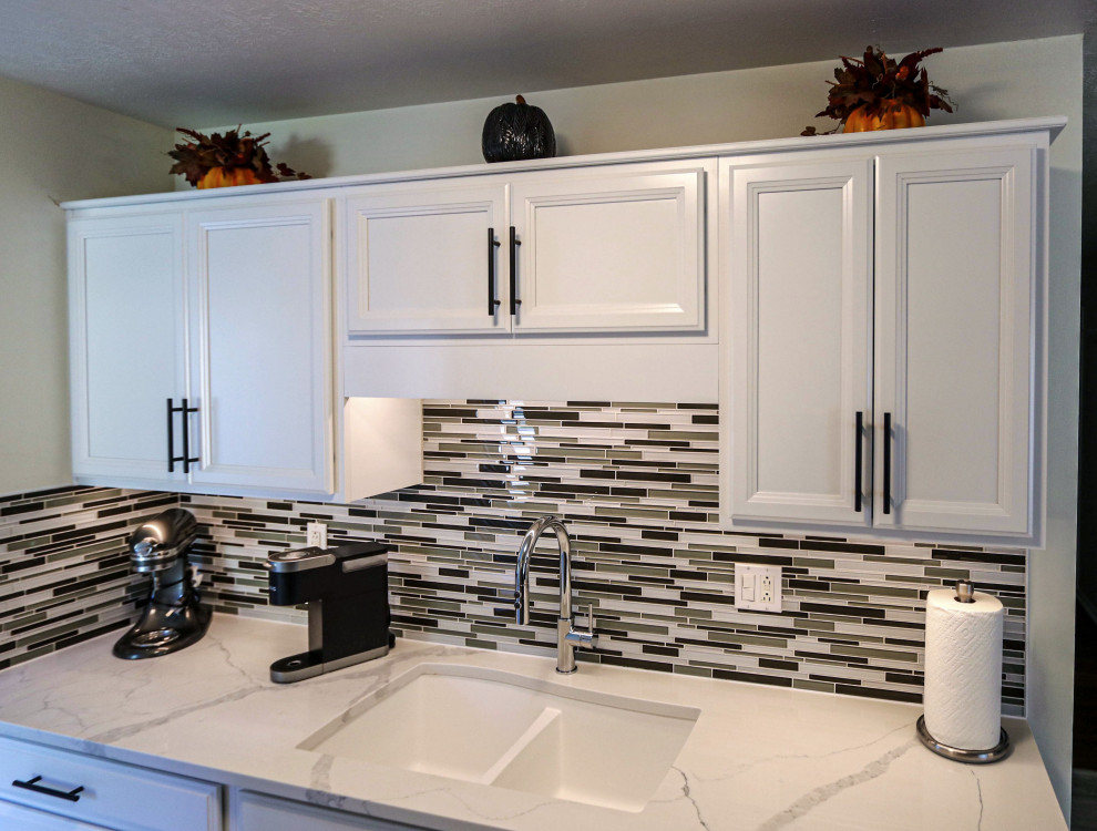 White Kitchen with Quartz Countertop and Mosaic Tile Backsplash ...