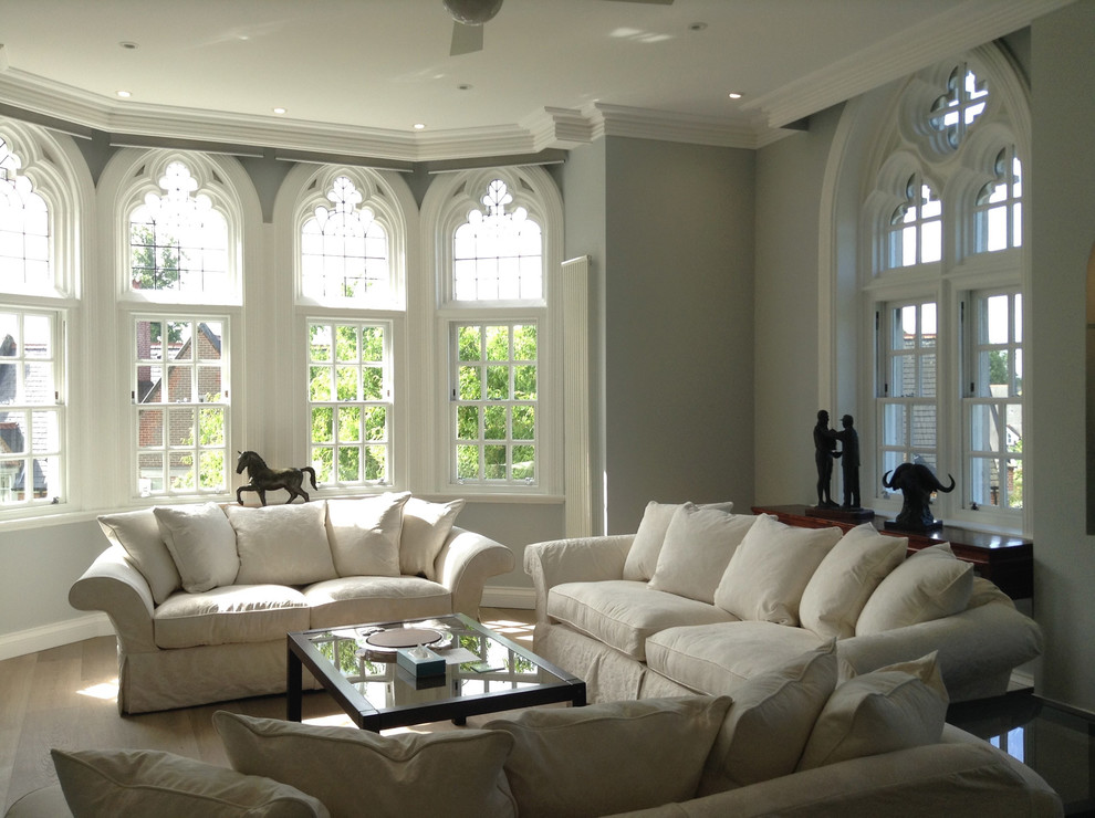 Inspiration for a large transitional open concept living room in St Louis with grey walls and medium hardwood floors.