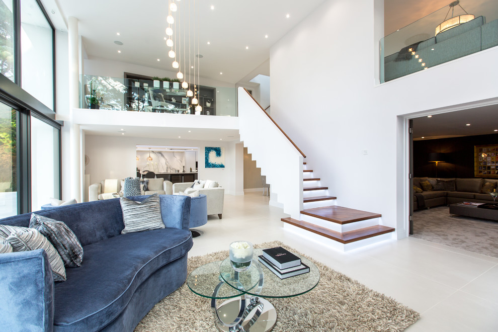 Photo of a contemporary living room in Dorset with porcelain floors and white floor.