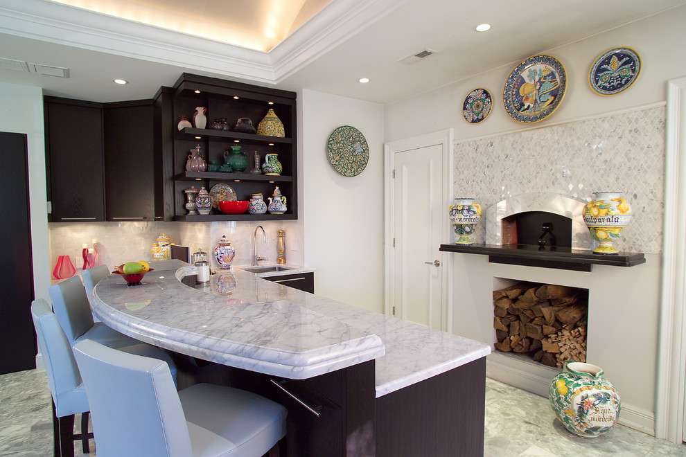 Transitional kitchen in New York with an undermount sink, open cabinets, dark wood cabinets and white splashback.