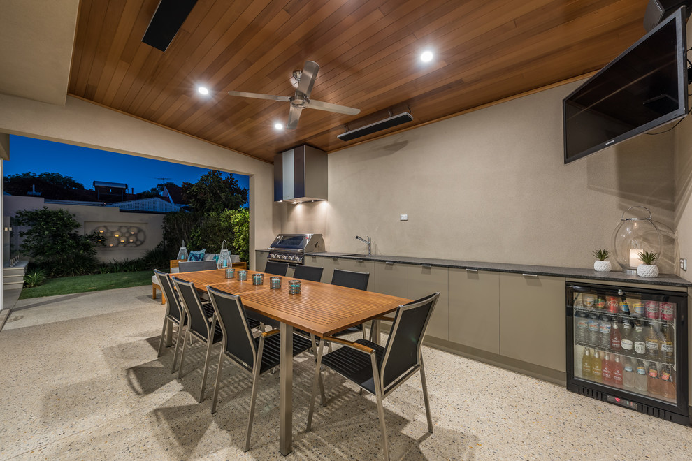 This is an example of a contemporary patio in Perth with an outdoor kitchen and a roof extension.