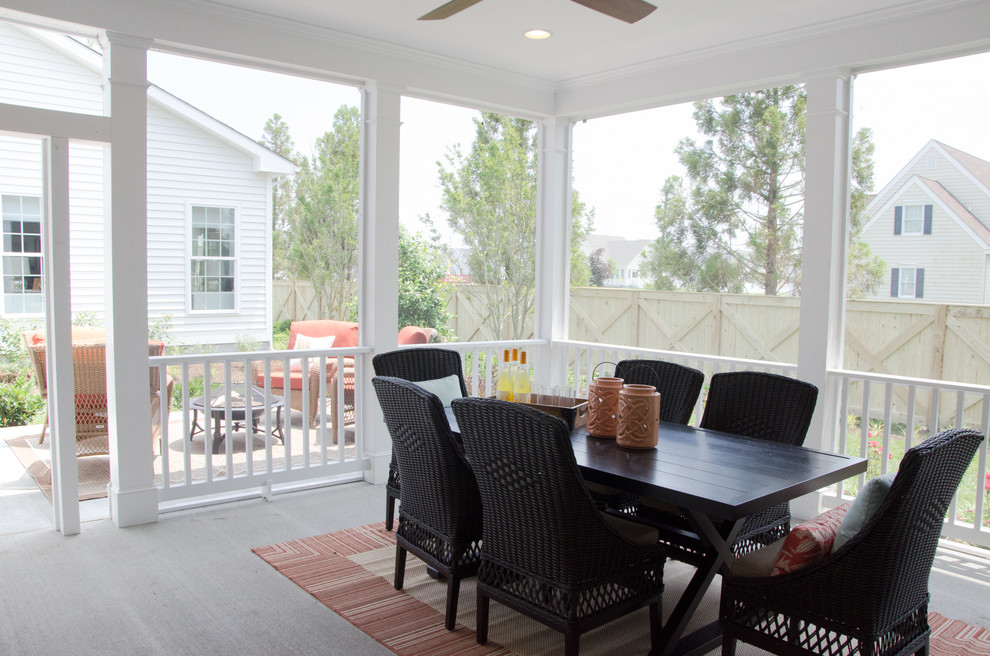 Beach style backyard deck photo with an awning