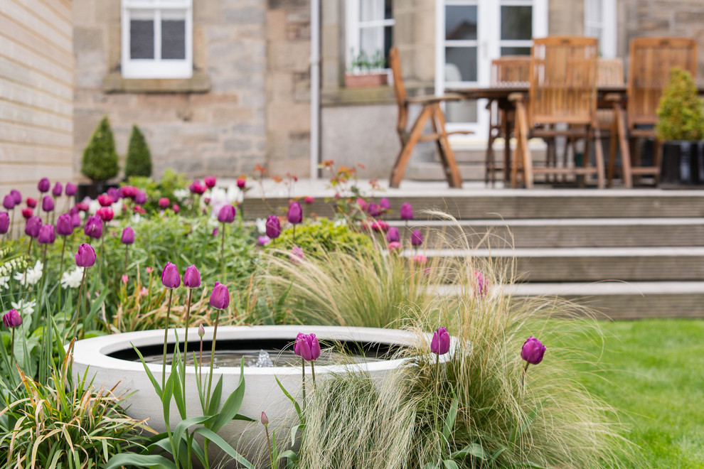 Design ideas for a transitional backyard full sun garden for summer in Edinburgh.