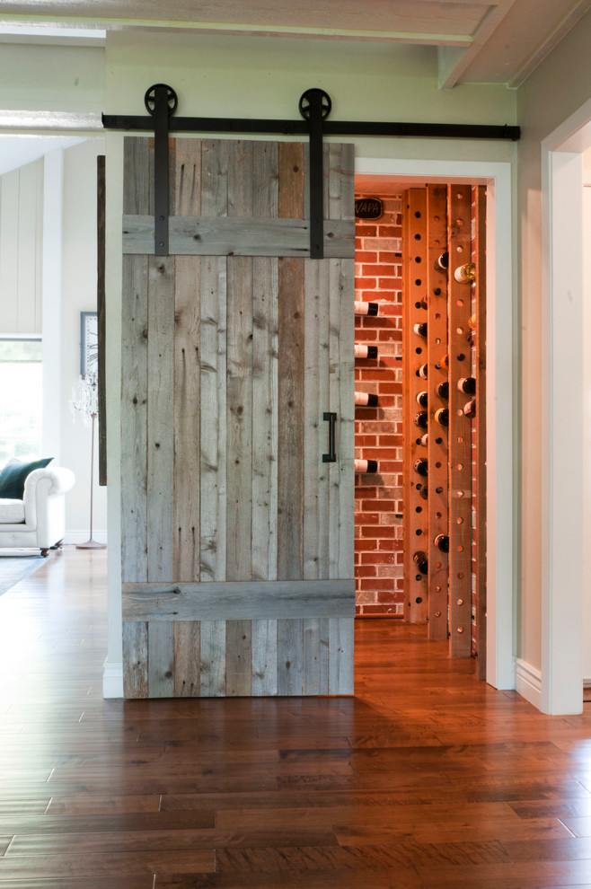 This is an example of a transitional wine cellar in Dallas.