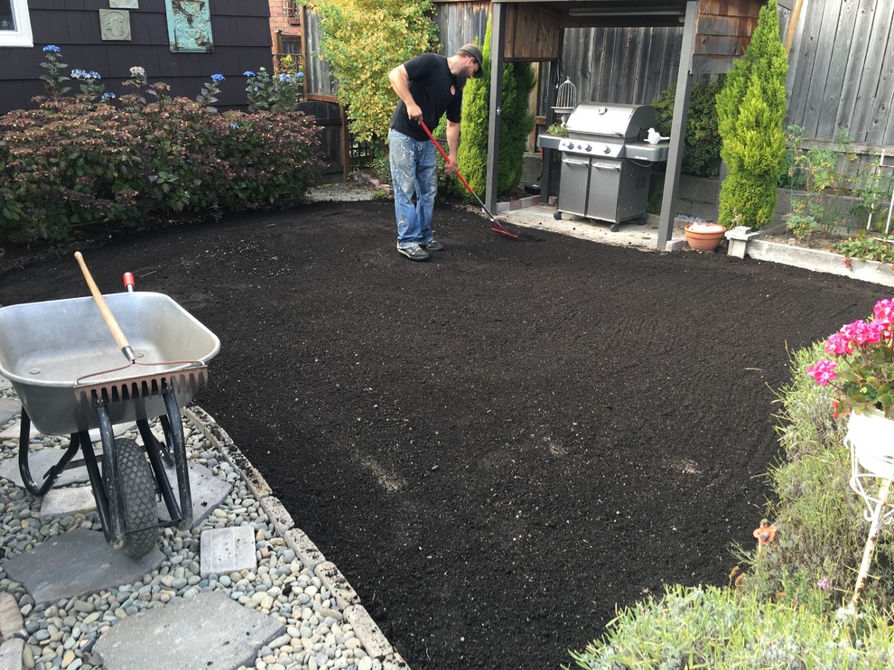 Inspiration for a full sun backyard stone formal garden in Seattle for spring.