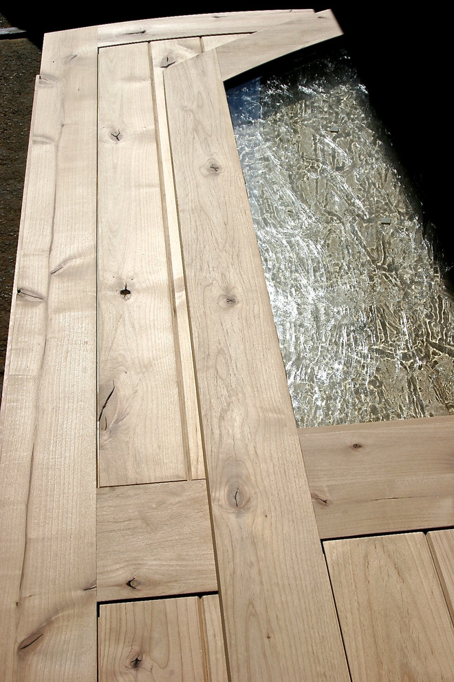 Large mountain style front door photo with a medium wood front door