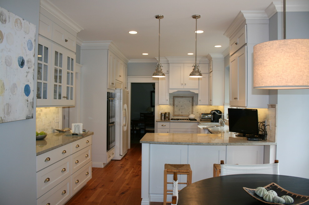 Inspiration for a transitional kitchen remodel in Nashville with flat-panel cabinets, white cabinets and granite countertops