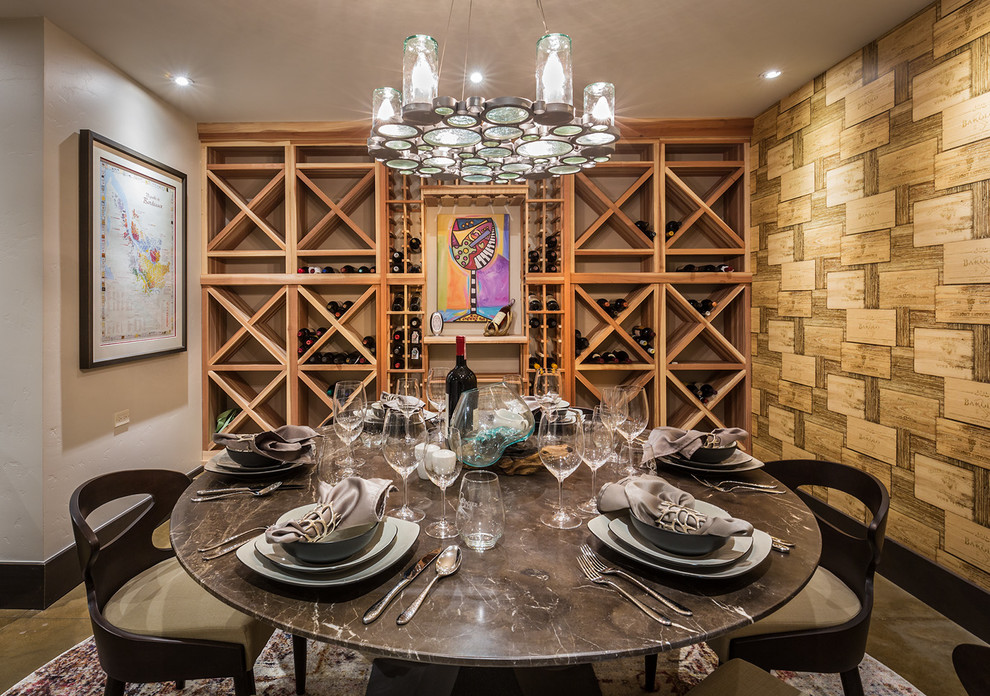 Large contemporary wine cellar in Albuquerque with concrete floors and storage racks.