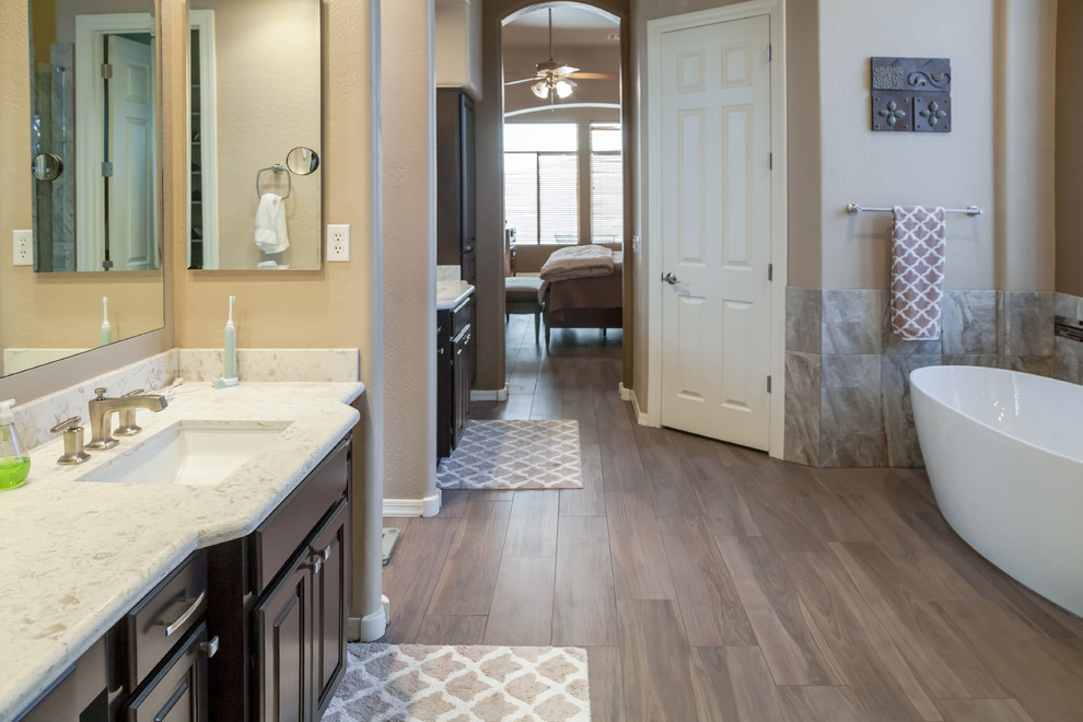 Inspiration for a transitional master porcelain tile bedroom remodel in Phoenix with beige walls
