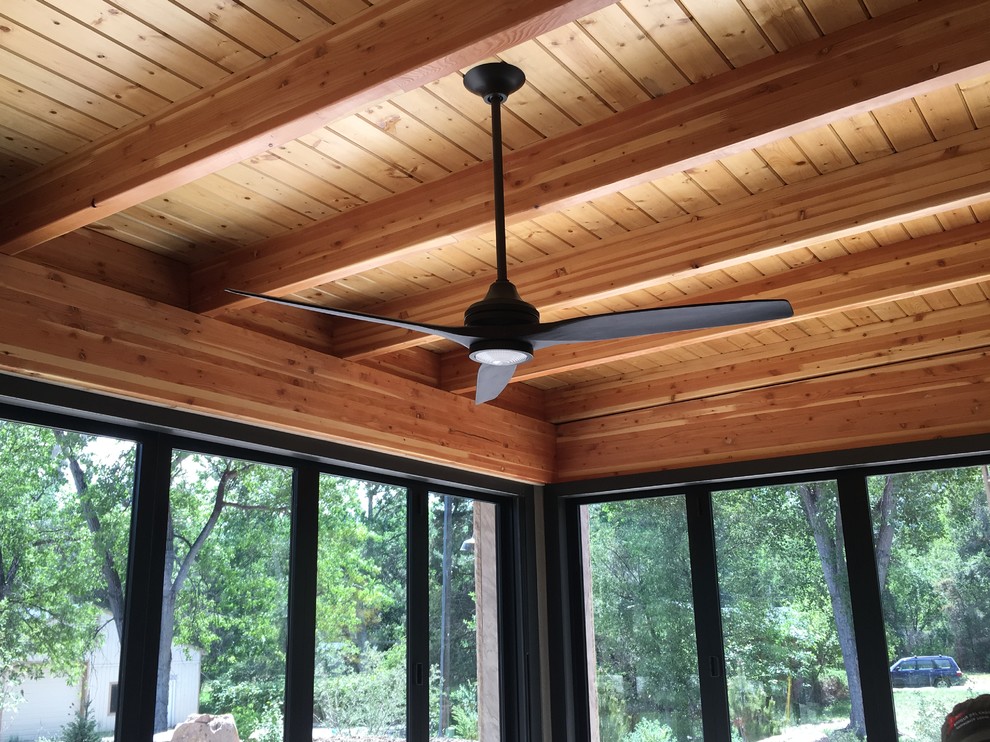 Transitional home design photo in Denver with white walls