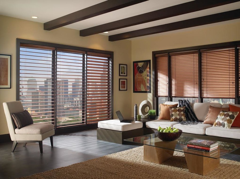 This is an example of a mid-sized asian formal enclosed living room in San Francisco with beige walls, dark hardwood floors, no fireplace, no tv and brown floor.