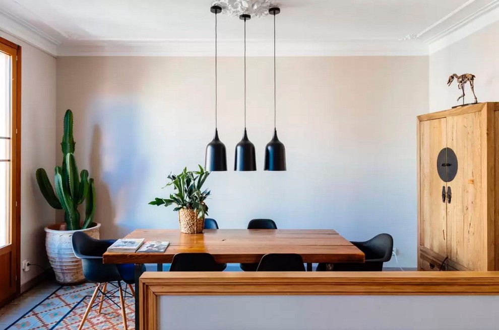 Photo of a mid-sized contemporary separate dining room in Barcelona with white walls, ceramic floors and no fireplace.