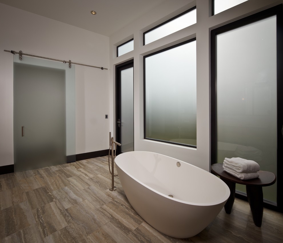 Design ideas for a modern bathroom in Houston with a freestanding tub.