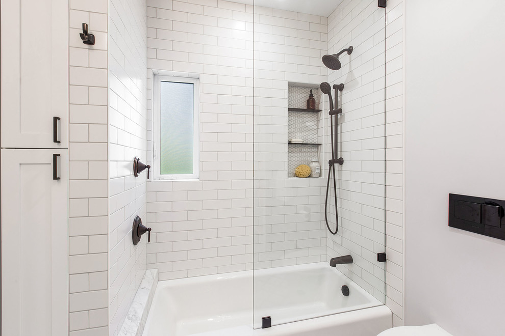 Design ideas for a mid-sized transitional bathroom in San Francisco with flat-panel cabinets, white cabinets, an alcove tub, a shower/bathtub combo, a wall-mount toilet, white tile, ceramic tile, grey walls, porcelain floors, an undermount sink, multi-coloured floor, an open shower and white benchtops.
