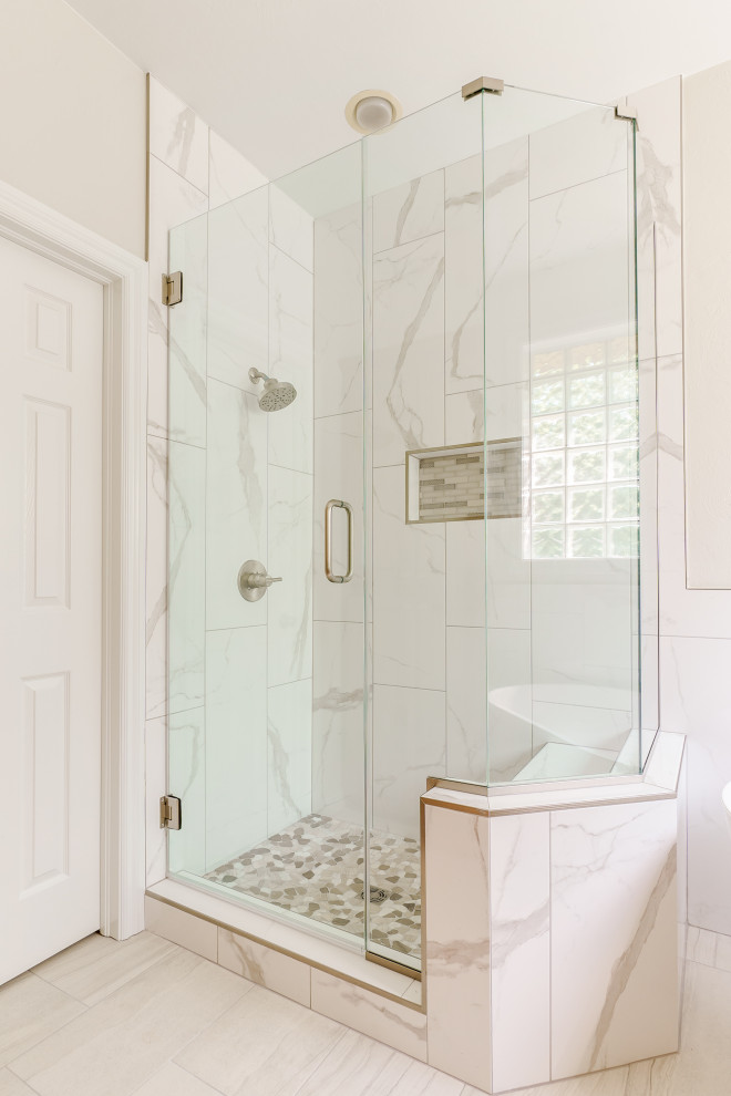 Design ideas for a mid-sized transitional master bathroom in Oklahoma City with a freestanding tub, a corner shower, a hinged shower door, a double vanity and a built-in vanity.