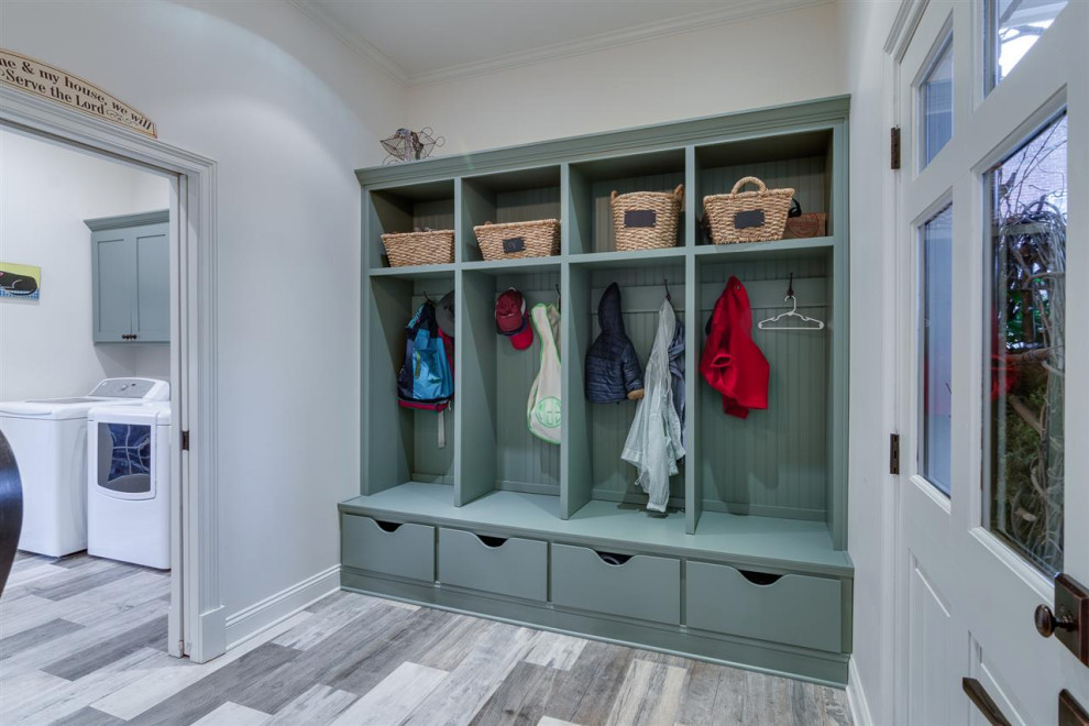 Inspiration for a mid-sized country mudroom in Other with blue walls, laminate floors, a double front door, a blue front door and multi-coloured floor.