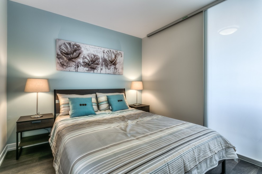 This is an example of a mid-sized modern guest bedroom in Toronto with dark hardwood floors.