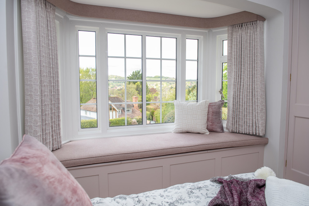 Inspiration for a medium sized contemporary master bedroom in Oxfordshire with pink walls, carpet, beige floors, a wallpapered ceiling and wallpapered walls.