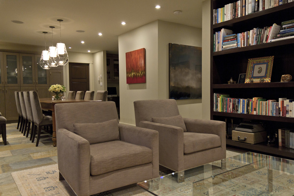 This is an example of a mid-sized contemporary open concept family room in Edmonton with beige walls.