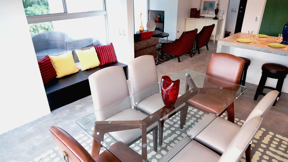 Example of a mid-sized transitional concrete floor great room design with white walls