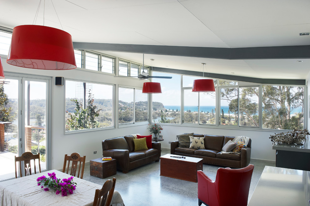 Design ideas for a contemporary open concept living room in Central Coast with white walls.