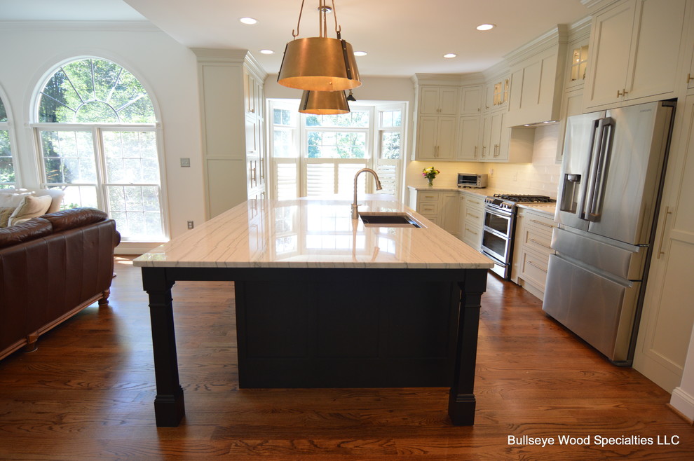 Large transitional u-shaped medium tone wood floor and brown floor eat-in kitchen photo in DC Metro with a single-bowl sink, shaker cabinets, gray cabinets, quartzite countertops, white backsplash, ceramic backsplash, stainless steel appliances, an island and white countertops