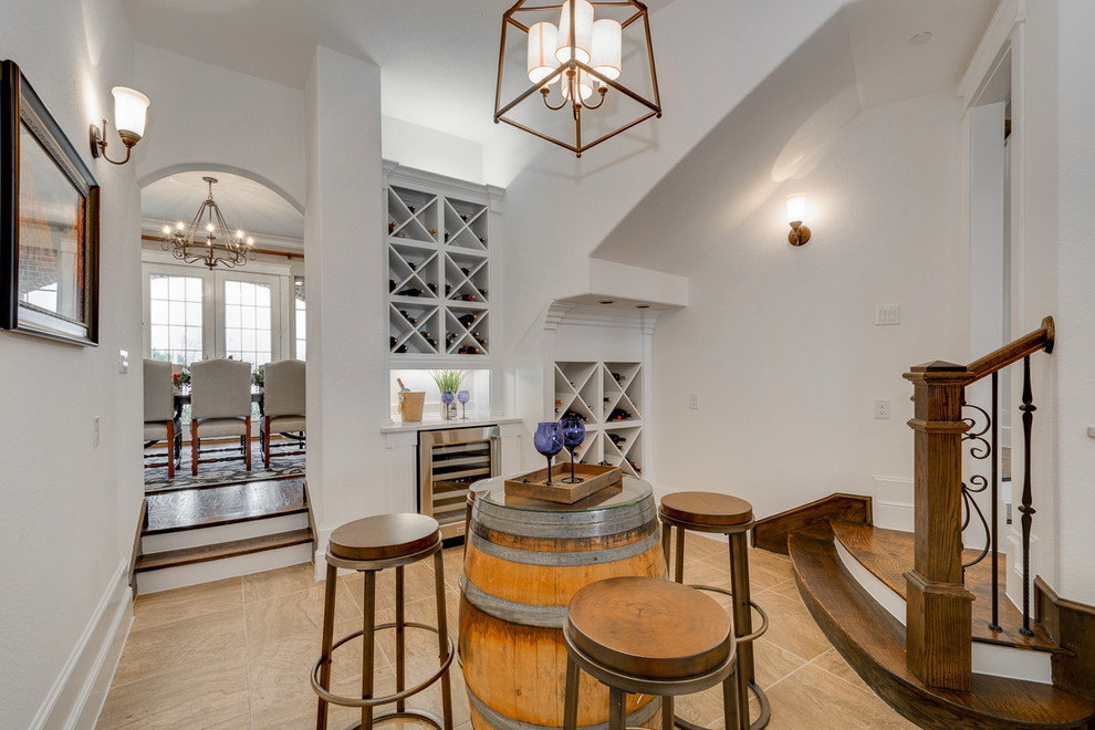 Inspiration for a traditional wine cellar in Dallas with porcelain floors and diamond bins.