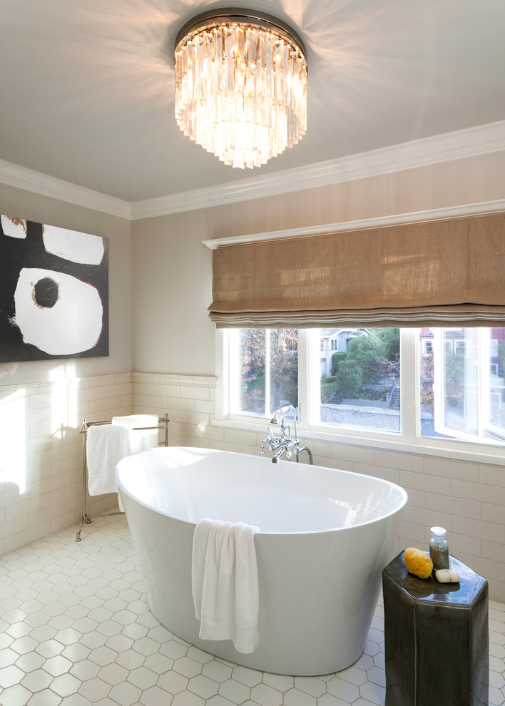 This is an example of a mid-sized contemporary master bathroom in San Francisco with a freestanding tub, ceramic floors, onyx benchtops and white floor.